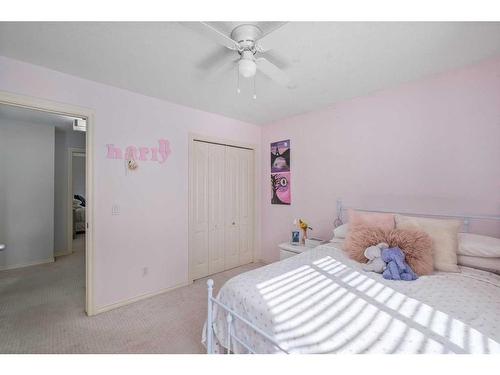 15 Cougar Ridge View Sw, Calgary, AB - Indoor Photo Showing Bedroom