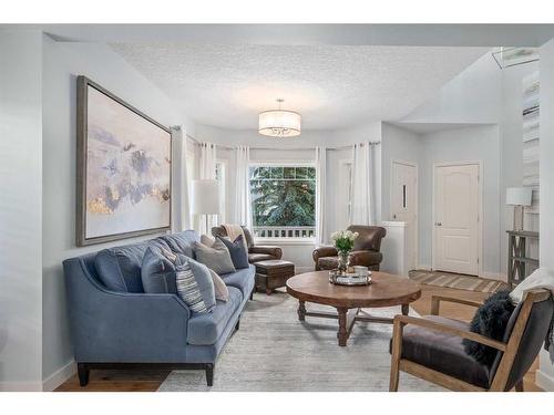 15 Cougar Ridge View Sw, Calgary, AB - Indoor Photo Showing Living Room