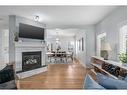 15 Cougar Ridge View Sw, Calgary, AB  - Indoor Photo Showing Living Room With Fireplace 