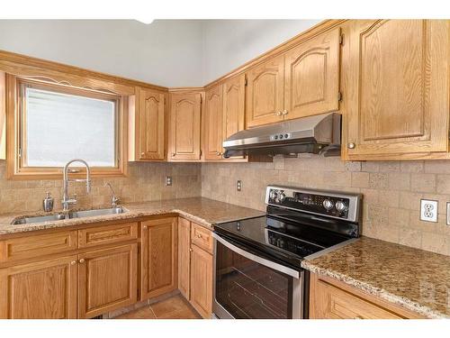 155 Macewan Park Rise Nw, Calgary, AB - Indoor Photo Showing Kitchen With Double Sink