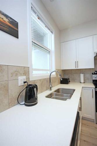 204-245 Redstone Walk Ne, Calgary, AB - Indoor Photo Showing Kitchen With Double Sink