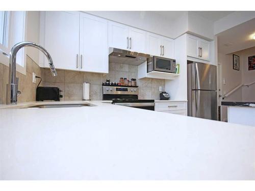 204-245 Redstone Walk Ne, Calgary, AB - Indoor Photo Showing Kitchen With Upgraded Kitchen