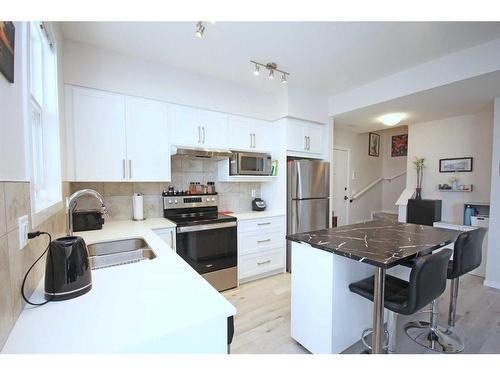 204-245 Redstone Walk Ne, Calgary, AB - Indoor Photo Showing Kitchen With Double Sink