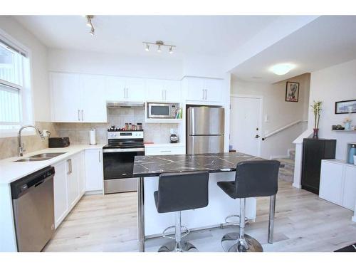 204-245 Redstone Walk Ne, Calgary, AB - Indoor Photo Showing Kitchen With Double Sink