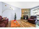 271 Deersaxon Circle Se, Calgary, AB  - Indoor Photo Showing Living Room With Fireplace 