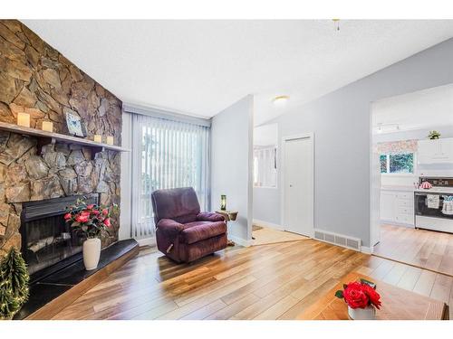 271 Deersaxon Circle Se, Calgary, AB - Indoor Photo Showing Living Room With Fireplace