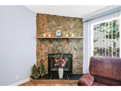 271 Deersaxon Circle Se, Calgary, AB - Indoor Photo Showing Living Room With Fireplace