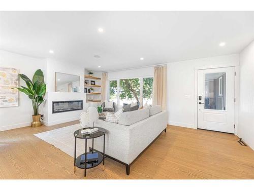 1211 Lake Twintree Drive Se, Calgary, AB - Indoor Photo Showing Living Room With Fireplace