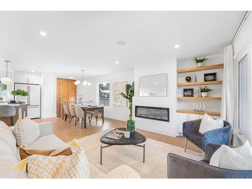 1211 Lake Twintree Drive Se, Calgary, AB - Indoor Photo Showing Living Room With Fireplace