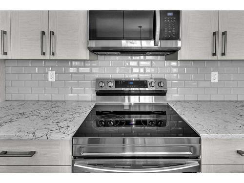 201-100 Harvest Hills Place Ne, Calgary, AB - Indoor Photo Showing Kitchen With Upgraded Kitchen