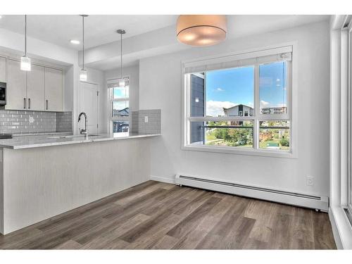 201-100 Harvest Hills Place Ne, Calgary, AB - Indoor Photo Showing Kitchen With Upgraded Kitchen