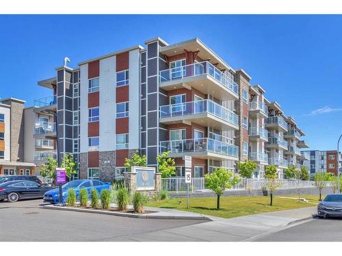 201-100 Harvest Hills Place Ne, Calgary, AB - Outdoor With Balcony With Facade