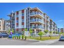 201-100 Harvest Hills Place Ne, Calgary, AB  - Outdoor With Balcony With Facade 