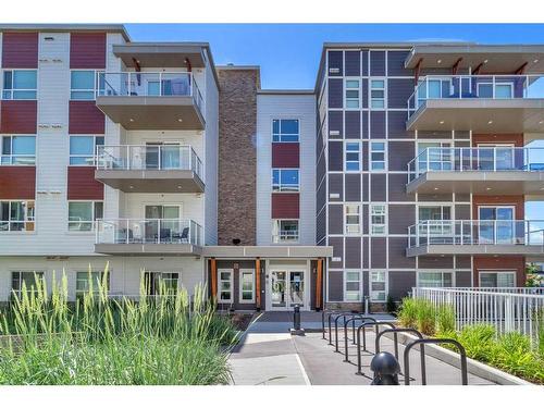 201-100 Harvest Hills Place Ne, Calgary, AB - Outdoor With Balcony With Facade