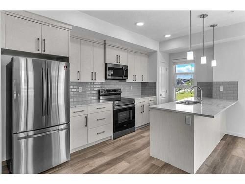 201-100 Harvest Hills Place Ne, Calgary, AB - Indoor Photo Showing Kitchen With Upgraded Kitchen