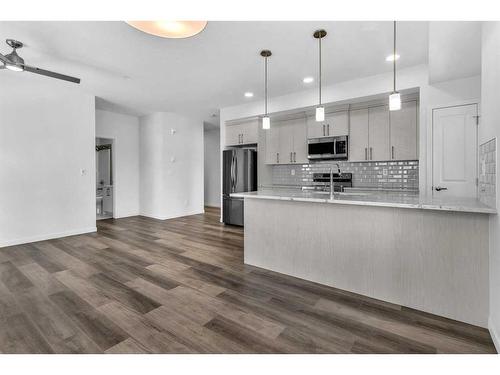 201-100 Harvest Hills Place Ne, Calgary, AB - Indoor Photo Showing Kitchen With Upgraded Kitchen