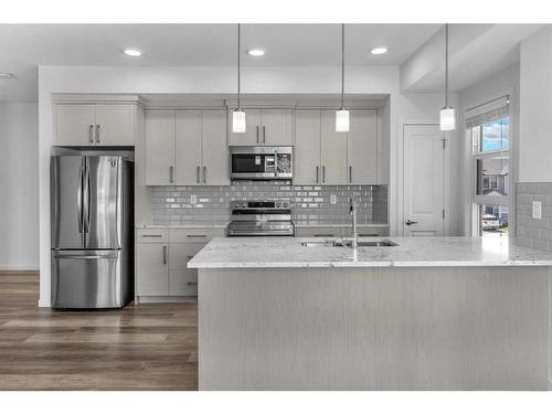 201-100 Harvest Hills Place Ne, Calgary, AB - Indoor Photo Showing Kitchen With Upgraded Kitchen