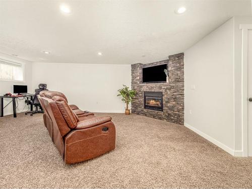 148 Heritage Rd, Magrath, AB - Indoor With Fireplace