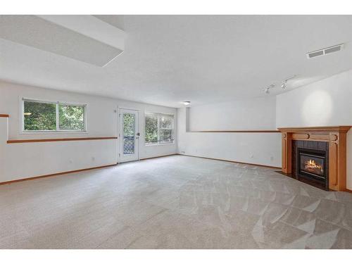 6530 Sierra Morena Boulevard Sw, Calgary, AB - Indoor With Fireplace