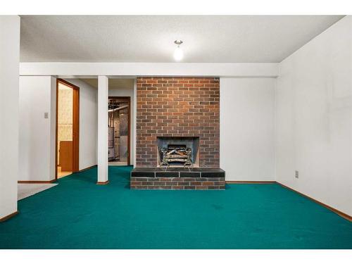 5711 Dalmead Crescent Nw, Calgary, AB - Indoor Photo Showing Other Room With Fireplace