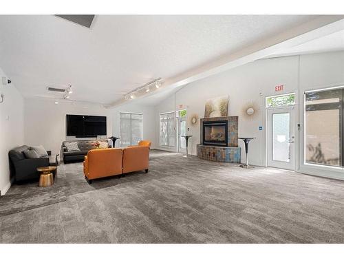 1107-24 Hemlock Crescent Sw, Calgary, AB - Indoor Photo Showing Living Room With Fireplace