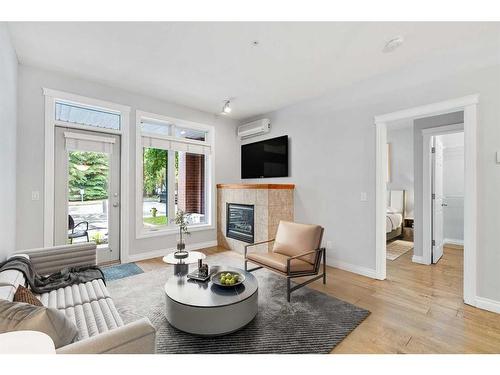 1107-24 Hemlock Crescent Sw, Calgary, AB - Indoor Photo Showing Living Room With Fireplace