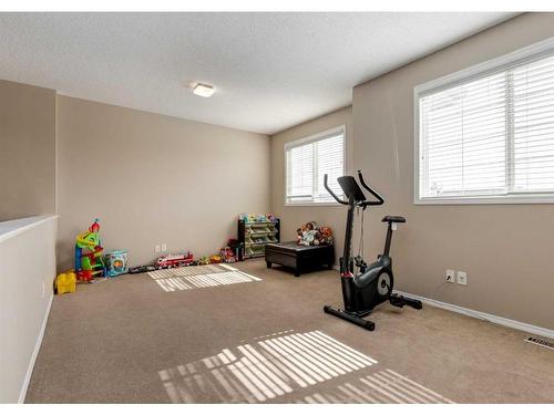 2080 Reunion Boulevard Nw, Airdrie, AB - Indoor Photo Showing Gym Room