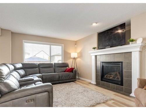 2080 Reunion Boulevard Nw, Airdrie, AB - Indoor Photo Showing Living Room With Fireplace