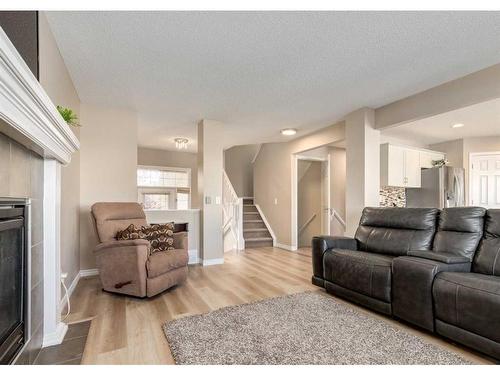 2080 Reunion Boulevard Nw, Airdrie, AB - Indoor Photo Showing Living Room With Fireplace