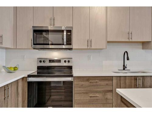 3417-298 Sage Meadows Park Nw, Calgary, AB - Indoor Photo Showing Kitchen With Upgraded Kitchen