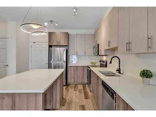 3417-298 Sage Meadows Park Nw, Calgary, AB - Indoor Photo Showing Kitchen With Stainless Steel Kitchen With Double Sink With Upgraded Kitchen