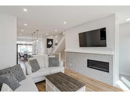 412 6A Street Ne, Calgary, AB - Indoor Photo Showing Living Room With Fireplace