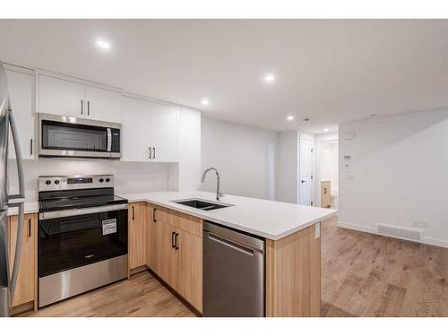 8 Royston Walk Nw, Calgary, AB - Indoor Photo Showing Kitchen With Double Sink