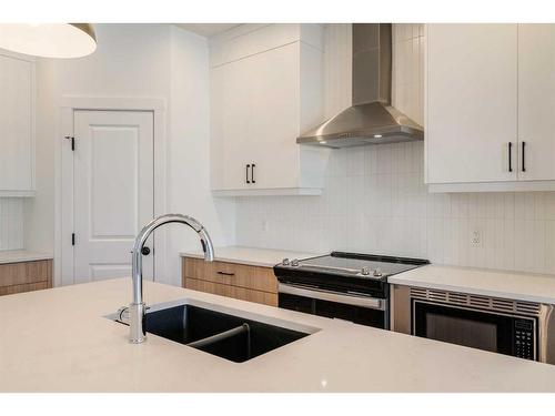 8 Royston Walk Nw, Calgary, AB - Indoor Photo Showing Kitchen With Double Sink With Upgraded Kitchen