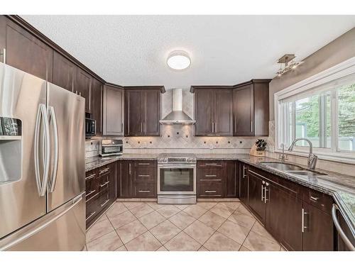 8 Arbour Glen Close Nw, Calgary, AB - Indoor Photo Showing Living Room With Fireplace