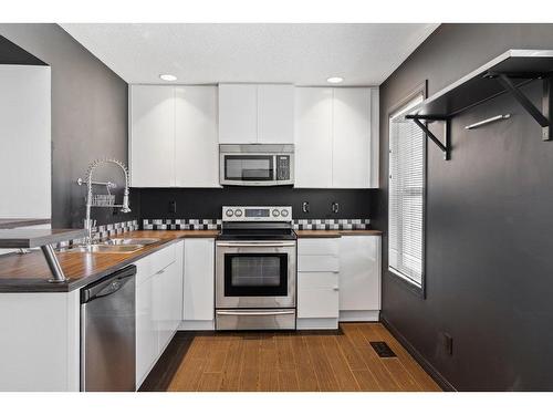 3338 New Brighton Gardens Se, Calgary, AB - Indoor Photo Showing Kitchen With Stainless Steel Kitchen With Double Sink