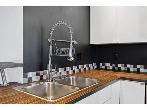 3338 New Brighton Gardens Se, Calgary, AB - Indoor Photo Showing Kitchen With Double Sink