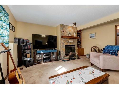 107 Scenic Glen Place Nw, Calgary, AB - Indoor Photo Showing Living Room With Fireplace