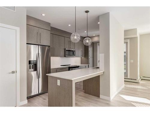 301-383 Smith Street Nw, Calgary, AB - Indoor Photo Showing Kitchen With Upgraded Kitchen