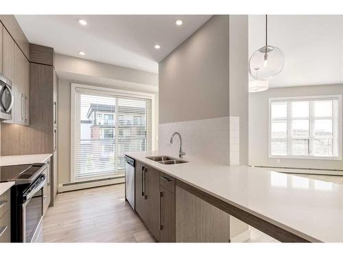 301-383 Smith Street Nw, Calgary, AB - Indoor Photo Showing Kitchen With Double Sink With Upgraded Kitchen