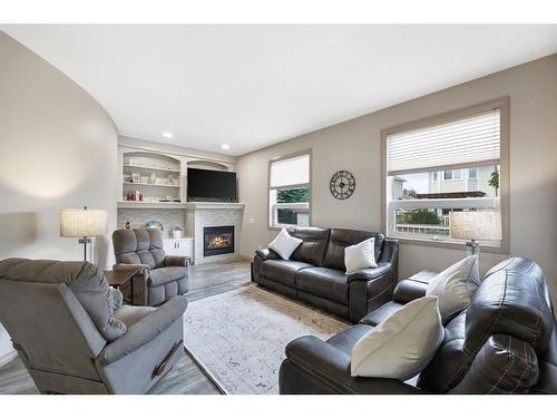 41 Thornbird Rise, Airdrie, AB - Indoor Photo Showing Living Room With Fireplace