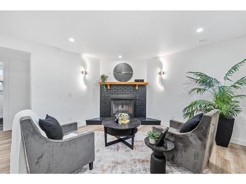 616 Cedarille Way Sw, Calgary, AB - Indoor Photo Showing Living Room With Fireplace