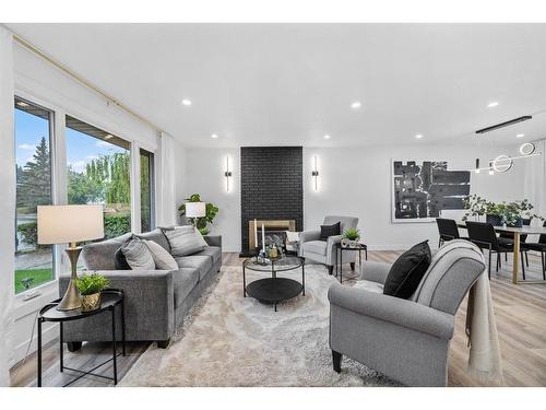 616 Cedarille Way Sw, Calgary, AB - Indoor Photo Showing Living Room With Fireplace