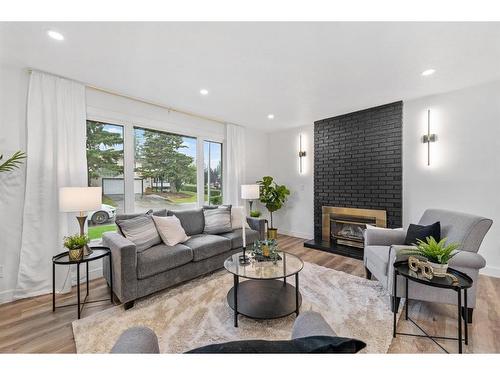 616 Cedarille Way Sw, Calgary, AB - Indoor Photo Showing Living Room With Fireplace