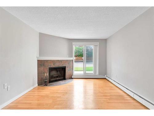 3105-13045 6 Street Sw, Calgary, AB - Indoor Photo Showing Living Room With Fireplace