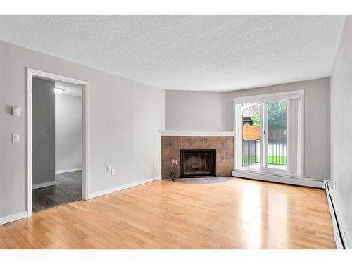 3105-13045 6 Street Sw, Calgary, AB - Indoor Photo Showing Living Room With Fireplace