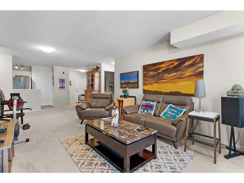 2327-1818 Simcoe Boulevard Sw, Calgary, AB - Indoor Photo Showing Living Room