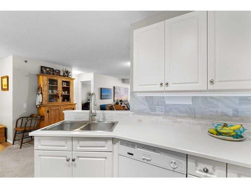 2327-1818 Simcoe Boulevard Sw, Calgary, AB - Indoor Photo Showing Kitchen With Double Sink