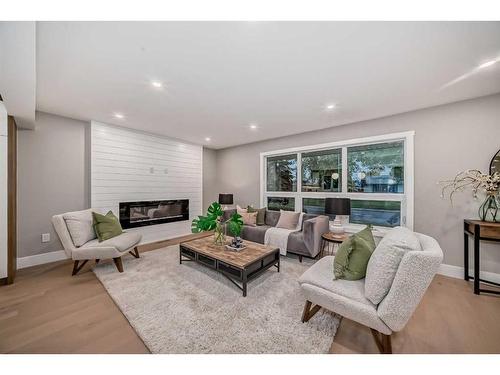 1132 Lake Christina Place Se, Calgary, AB - Indoor Photo Showing Living Room With Fireplace