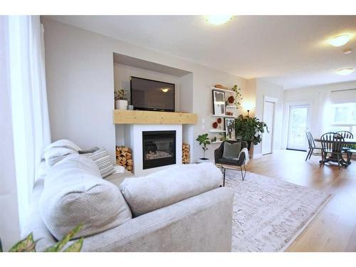 233 Evansdale Landing Nw, Calgary, AB - Indoor Photo Showing Living Room With Fireplace